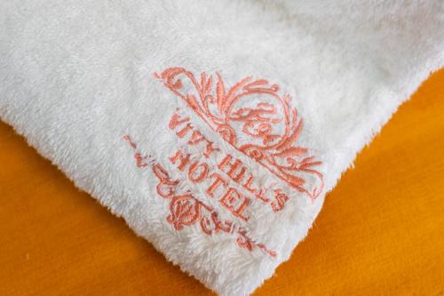 a white napkin with the words happy new year on it at Vivy Hill's Hotel in Port-au-Prince
