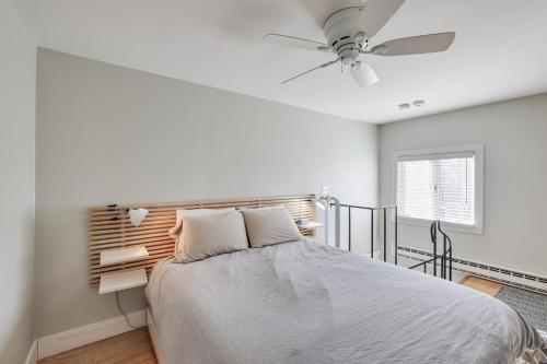 a bedroom with a bed and a ceiling fan at Provincetown Condo Walk to the Beach! in Provincetown