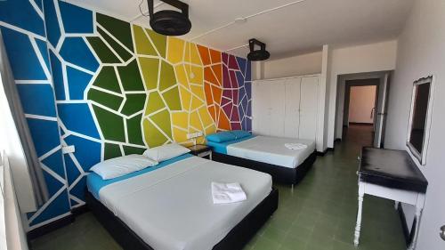 Una cama o camas en una habitación de Panamerican Hostel