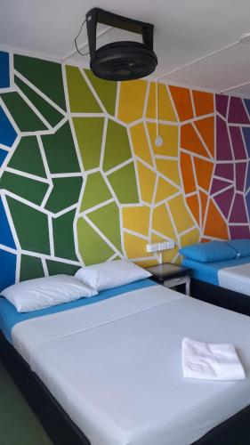 Una cama o camas en una habitación de Panamerican Hostel