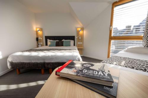 Ein Bett oder Betten in einem Zimmer der Unterkunft Best Western Le Moulin de Ducey