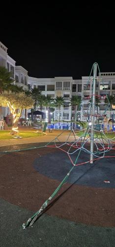 a pole that is laying on the street at night at COSTA BEACH Lux Family Apartment with Pools in Bouznika