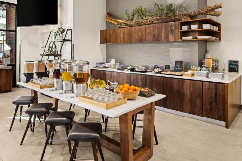 a kitchen with a table with food on it at Element Bozeman in Bozeman