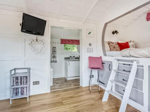 a bedroom with a bunk bed and a desk at Gwyneths Haven - Uk46404 in Cowbridge