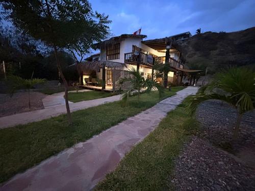 a house with a pathway in front of it at Casa Canoa in Canoas