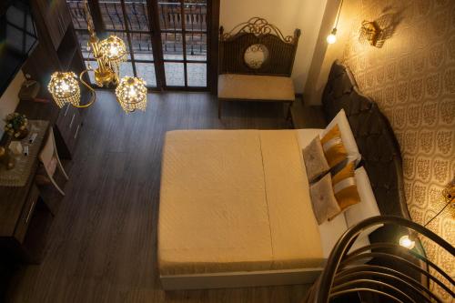 Ένα ή περισσότερα κρεβάτια σε δωμάτιο στο Ronda Hotel Boutique by Chat Noir