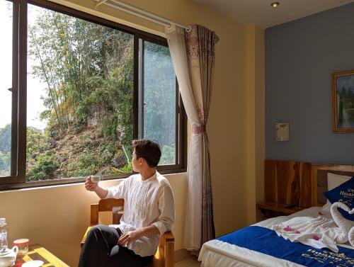 Postel nebo postele na pokoji v ubytování Khách sạn Hoàng Sơn