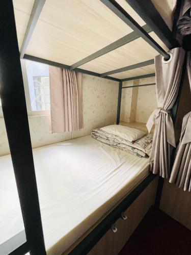 an empty bunk bed in a room at LATALAND HOSTEL in Ho Chi Minh City