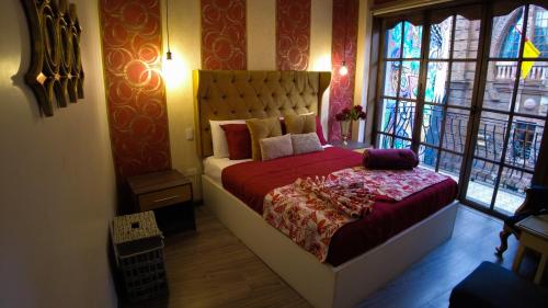 Ένα ή περισσότερα κρεβάτια σε δωμάτιο στο Ronda Hotel Boutique by Chat Noir