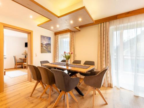 a dining room with a table and chairs at Apartment in Uderns near Spieljoch Ski in Uderns