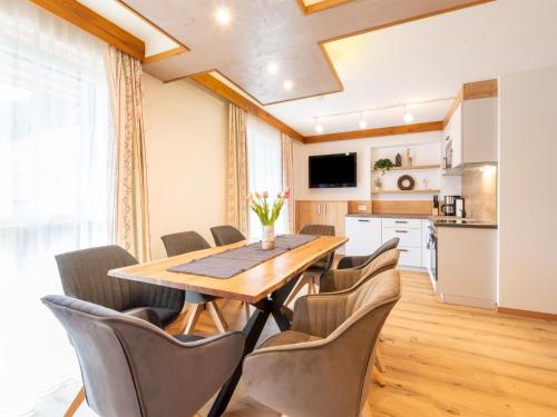 a dining room with a table and chairs at Apartment in Uderns near Spieljoch Ski in Uderns