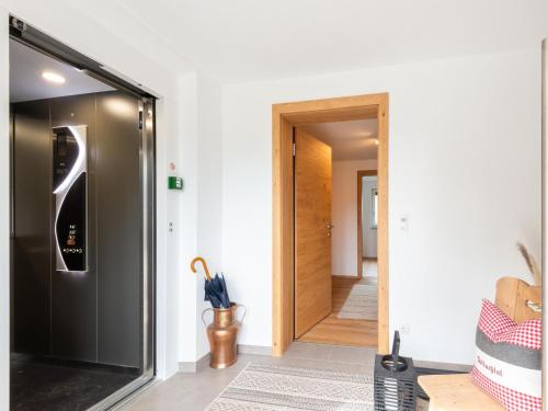 a hallway with a door leading into a room at Apartment in Uderns near Spieljoch Ski in Uderns