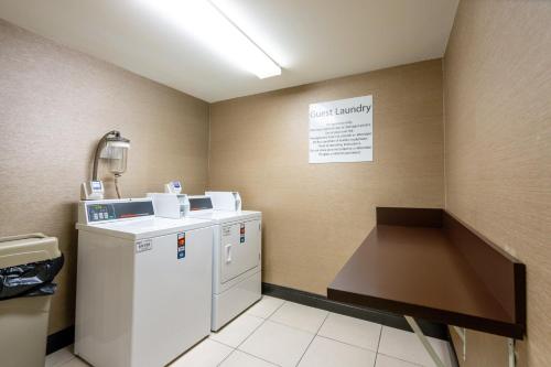 a laundry room with a washer and dryer at Holiday Inn Murfreesboro by IHG in Murfreesboro