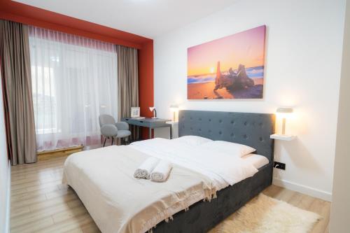 Un pat sau paturi într-o cameră la Alice Apartment