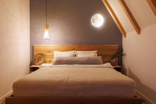 a bedroom with a large bed in a room at The Cliff Village in Comarnic