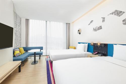 Voodi või voodid majutusasutuse Aloft Beijing Huairou toas