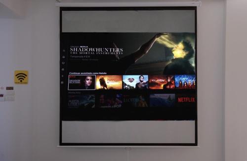 a poster of a movie on a wall at Keypad Hotel - 28 Dịch Vọng Hậu in Hanoi