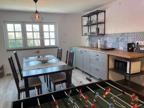 a kitchen with a table and a dining room at FeWo “ruhige Momente” in Waldkirch in Waldkirch