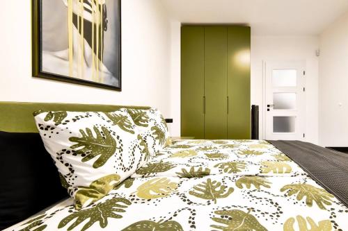 a bedroom with a bed with a green door at 2bdr Luxury Fully Equipped Prime Location in Sofia