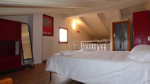 a bedroom with a white bed in a room at Gnazzano Home 1 in Loiano