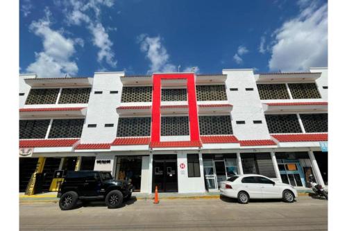 a large building with a large red x on it at OYO Hotel Puerta Sur in Comitán
