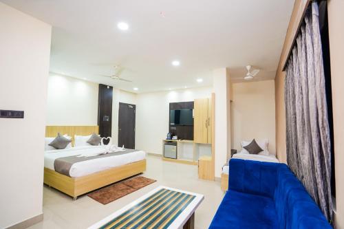 a hotel room with two beds and a couch at HOTEL MIDDLETON NXT in Bhubaneshwar