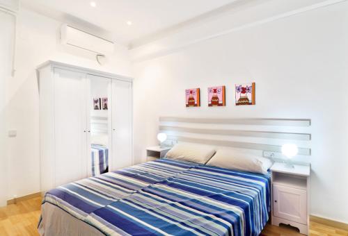 Postel nebo postele na pokoji v ubytování Apartment Gaudi XL