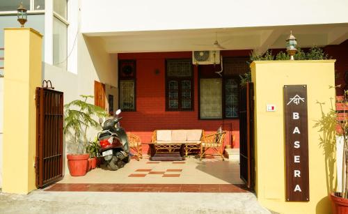 an entrance to a house with a bench and a porch at The Basera in Rishīkesh