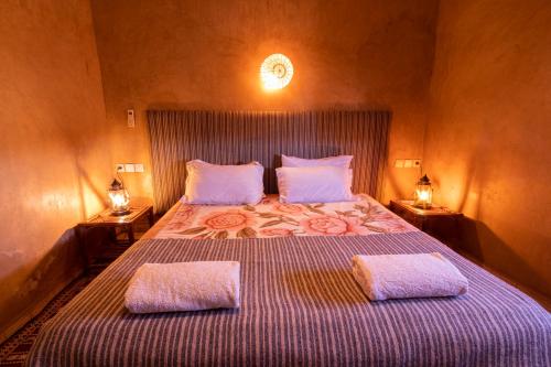 Hotel Kasbah Sahara Services - M'Hamid El Ghizlaneにあるベッド