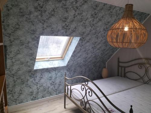 a bedroom with a bed and a window at Ferienwohnung Gipfelglück 50b für Familien in Hamburg