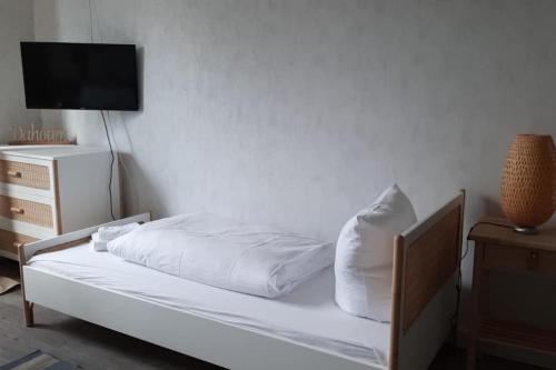 Gulta vai gultas numurā naktsmītnē Single Apartment Kleiner Watzmann 55 im schönen Sasel