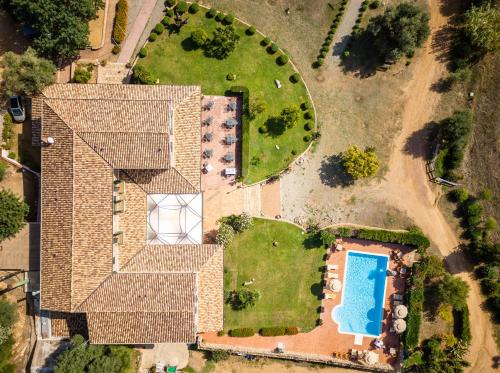 an overhead view of a house with a swimming pool at Hotel Janas in Tertenìa