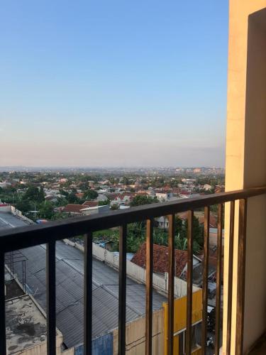 a view of a city from the balcony of a building at Ita Room Apartement Serpong Green View in Ciater-hilir