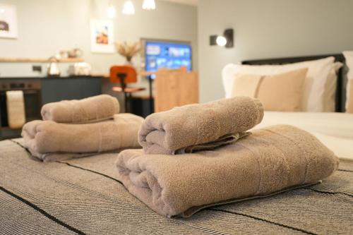 a pile of towels sitting on top of a bed at Tryfan - Snowdonia, North Wales in Bethesda