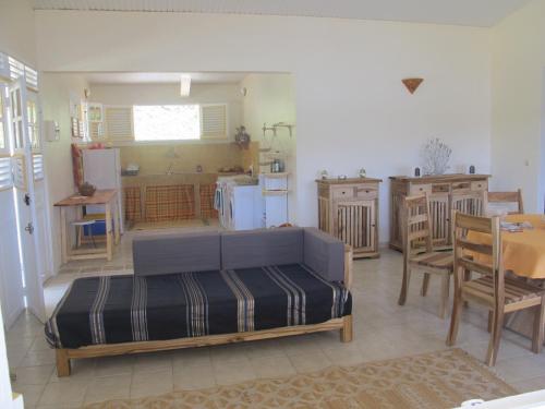 a living room with a bed and a kitchen at Villa Marie Daniel in Tartane