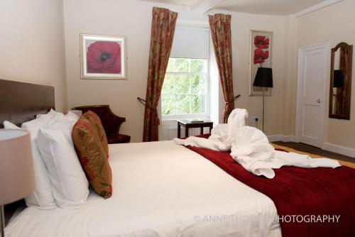 Ένα ή περισσότερα κρεβάτια σε δωμάτιο στο Best Western Priory Hotel