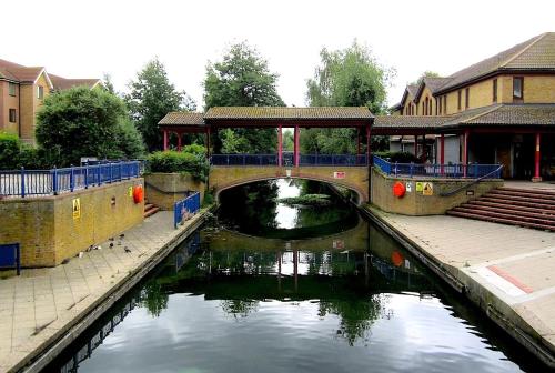 a bridge over a river in a city at Ensuite room in Thamesmead