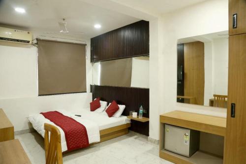 a bedroom with a bed and a large mirror at Bunk Hostel Delhi Best Backpacking Accommodation in New Delhi