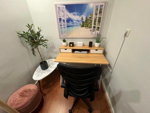 a small office with a desk and a window at City Haven Apartment in Chania Town