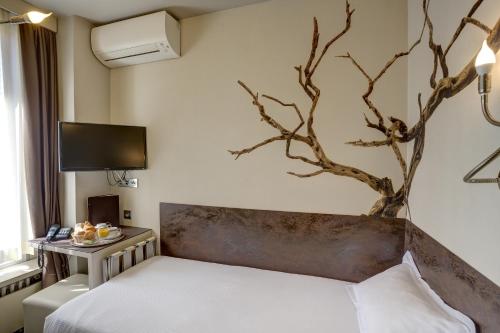 Posteľ alebo postele v izbe v ubytovaní Hotel Vivaldi