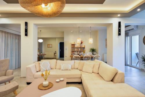 a living room with a couch and a table at City Haven Apartment in Chania Town