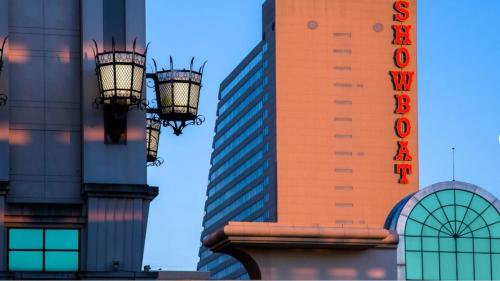 two street lights in front of a tall building at Beachfront 2BR 3BA Condo by CozySuites in Atlantic City