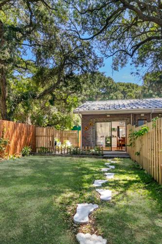 a backyard with a house and a fence at VB Escape in Knysna