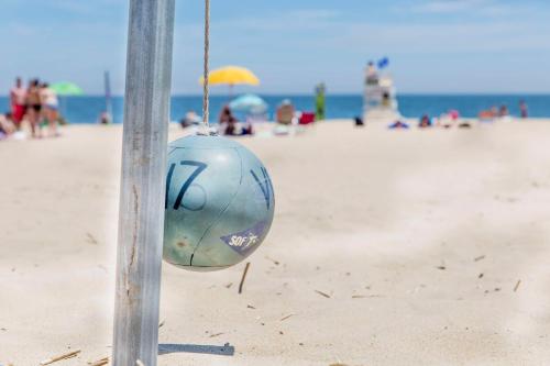 a ball hanging from a pole on the beach at Hyatt Place Dewey Beach in Dewey Beach