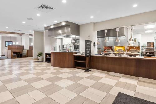 a lobby of a restaurant with a counter at Embassy Suites By Hilton Oahu Kapolei - FREE Breakfast in Kapolei