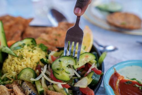 a fork is inserted into a plate of food at Complexe Hôtelier Sabah in Nouakchott