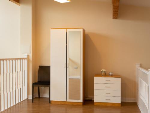 a closet with a white cabinet and a desk at Luxury 2 Bed Apartment – Near Heathrow, Legoland, Windsor Slough in Slough