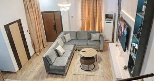 a living room with a couch and a table at Urban Haven in Lekki