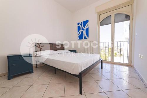 Postel nebo postele na pokoji v ubytování Blue Dreams - Marittima