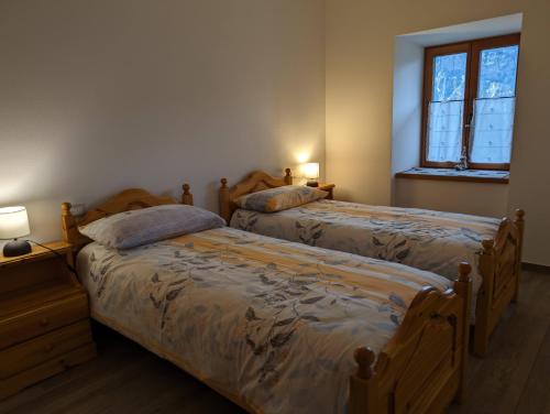 Postel nebo postele na pokoji v ubytování Baita Miralefre